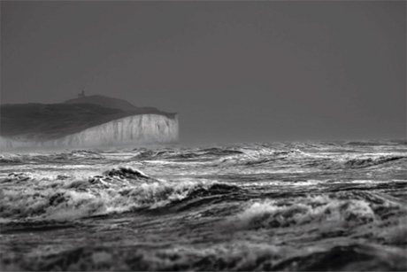 Photograph of turbulent seascape with Beachy Head cliffs in the background