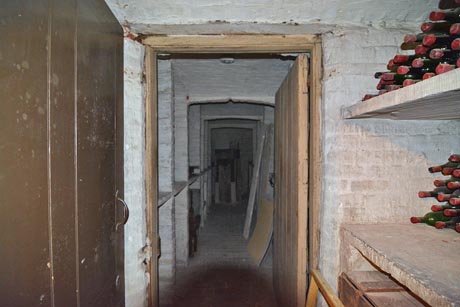 View of the wine cellar showing stone slab shelves