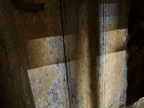 Limewashed hay loft above our stable