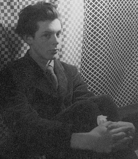 A monochrome photo of a well dressed young gentleman