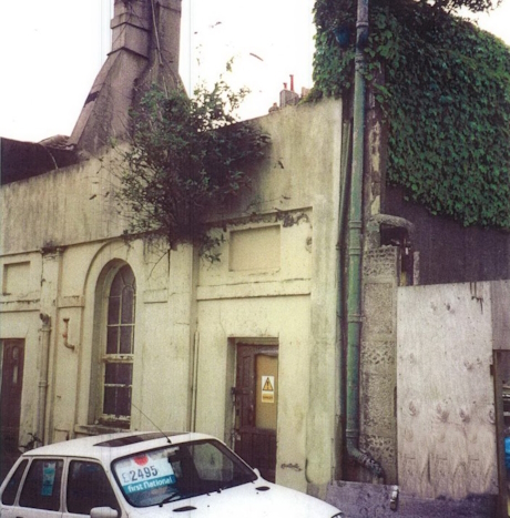 A colour photo of a derelict building