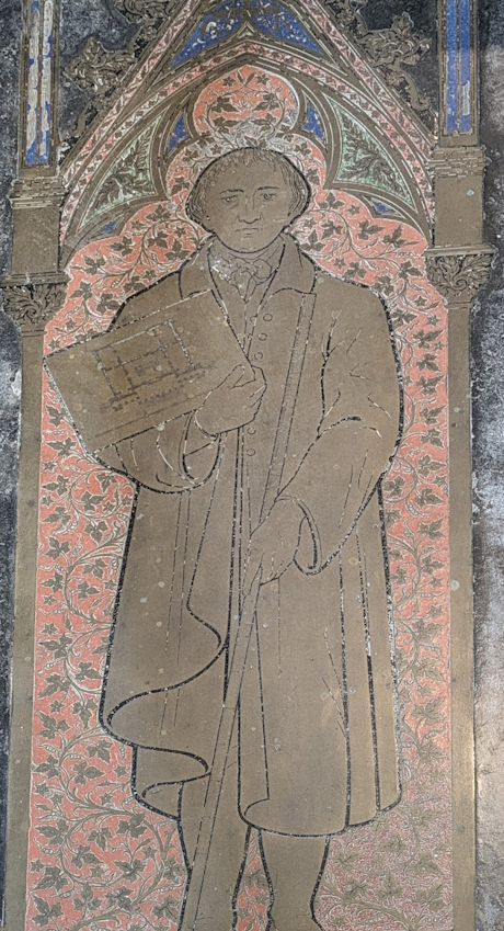 Colour photo of a tomb buried in the floor of a cathedral