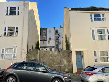 Colour photo of a gap between two houses