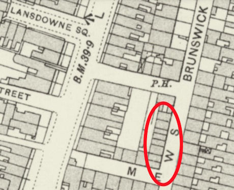 Image of an old map with a building marked by a red elipse