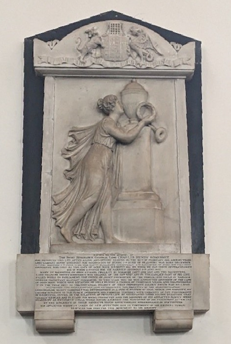 A coulour photo of a stone memorial plaque in the church