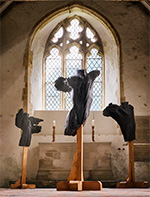 Thumbnail image of sculpted abstract torsos in a church setting