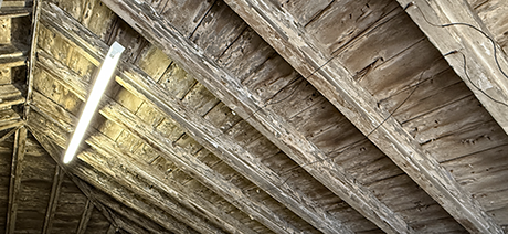 Limewashed hay loft above our stable