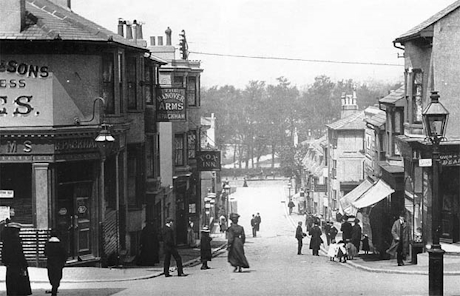 a monochrome photo of a steep street