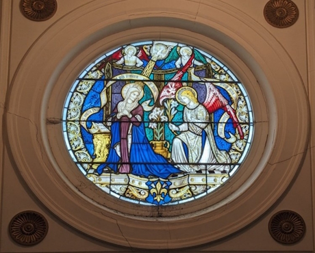 A colour photo of a window from inside the church