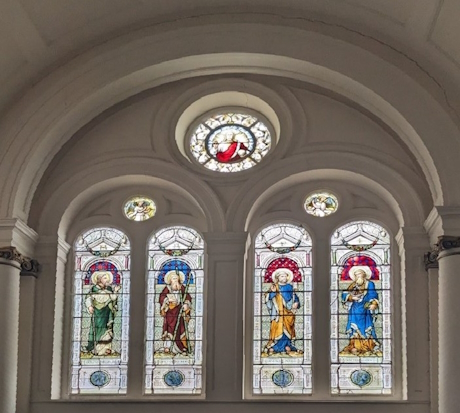 A colour photo of a stained glass window inside the church