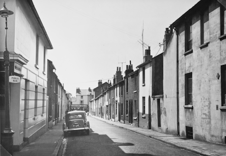 a monochrome photo of an old street