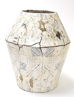 Thumbnail image of ceramic vase, Circular in planform, tapering to the base and top from a raised waistline, comprised of smaller segments joined together.